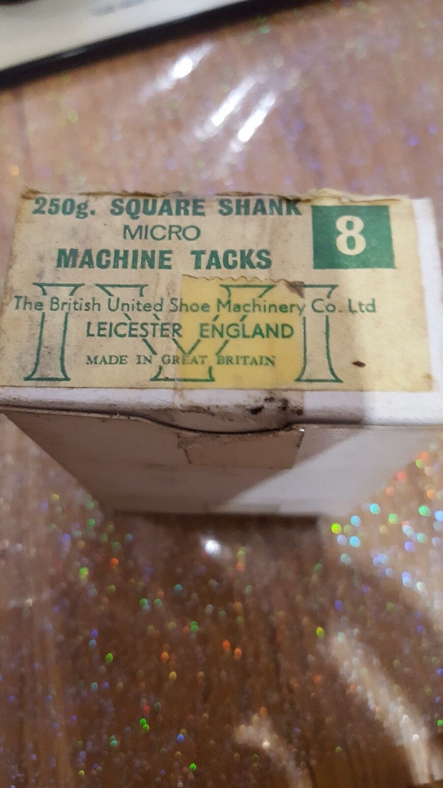 A box labelled 250g SQUARE SHANK MICRO MACHINE TACKS. 8 mm. The British Shoe Machinery Co. Ltd. LEICESTER, ENGLAND made in great Britain.