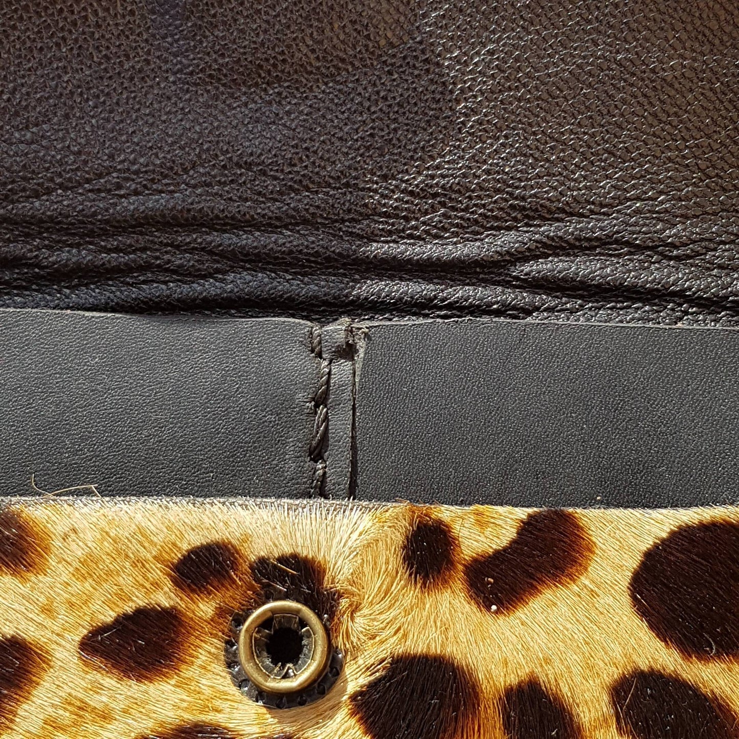 Close up view of two pocket leopard print hair-on leather wallet