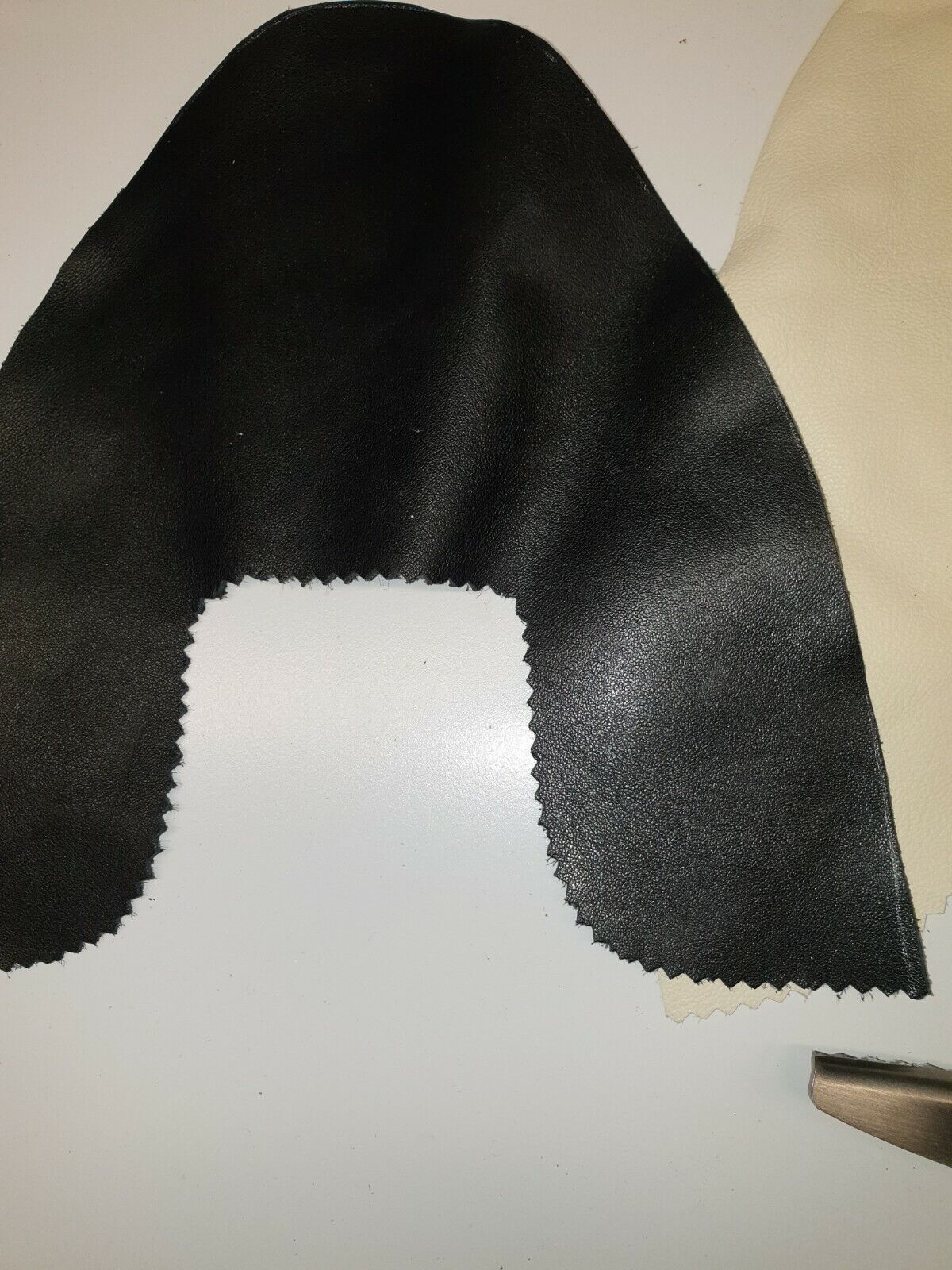 Close view of leather upper cut with pinking gimping scissors