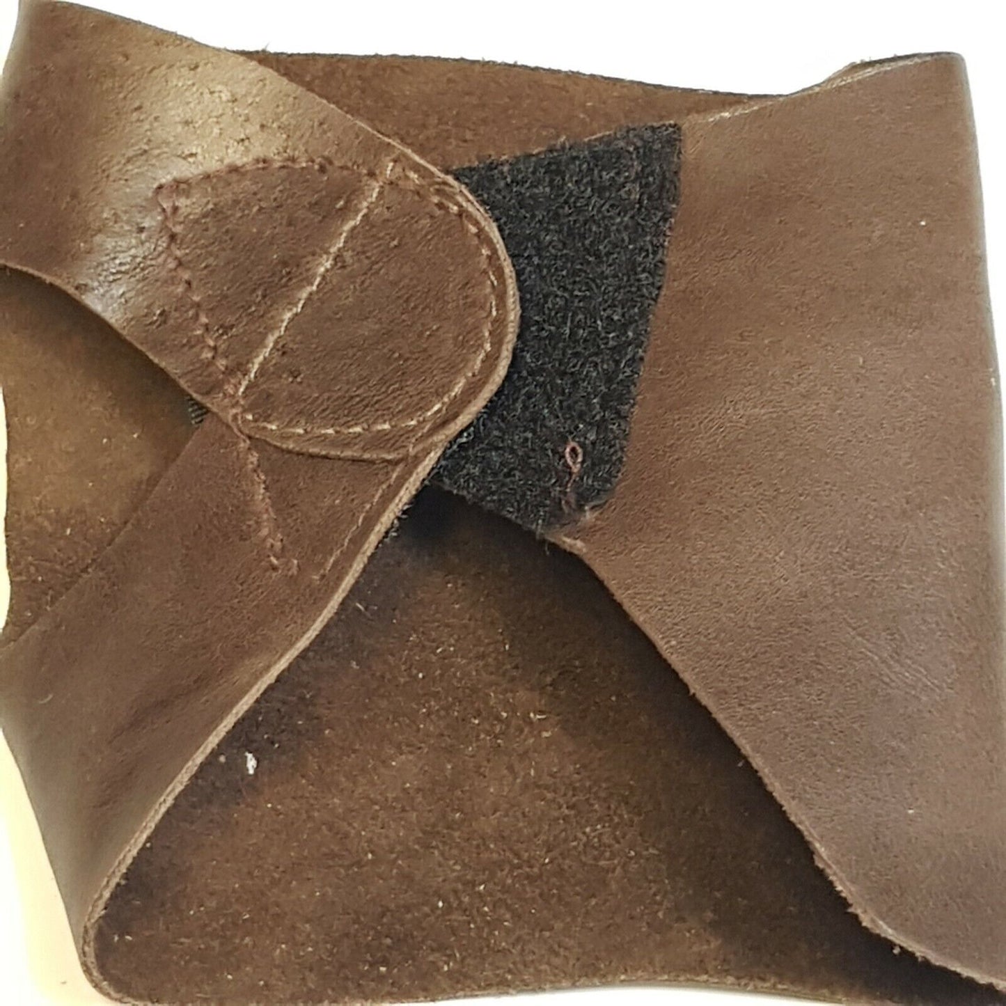 Close of folded leather palm showing hook and loop closurer