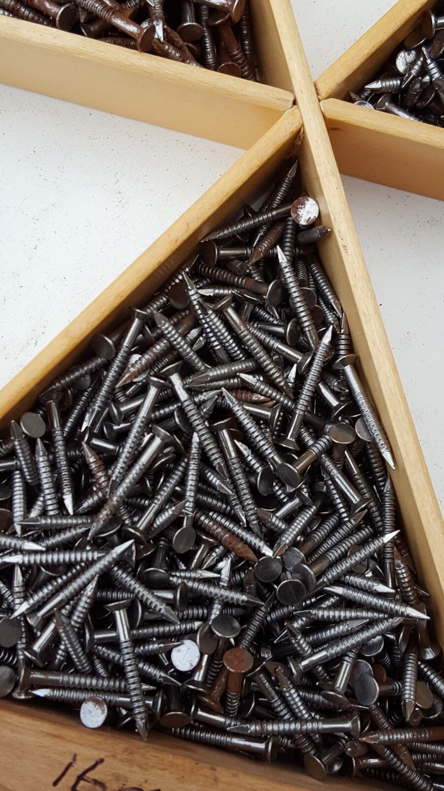 close view of 16mm buttress nails used for attaching heels