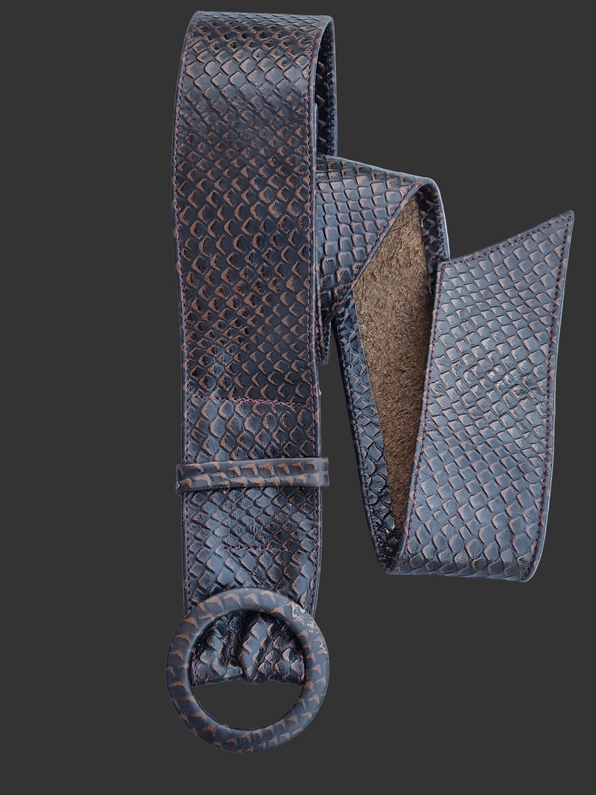 A dark brown rattle snakeskin embossed leather belt with matching buckle and showing one end, displayed on a light blue background.