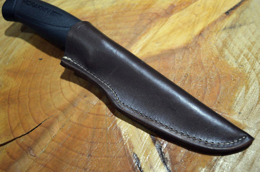 A black leather sheath for a Morakniv 860 type knife, with a black handle visible at the top.