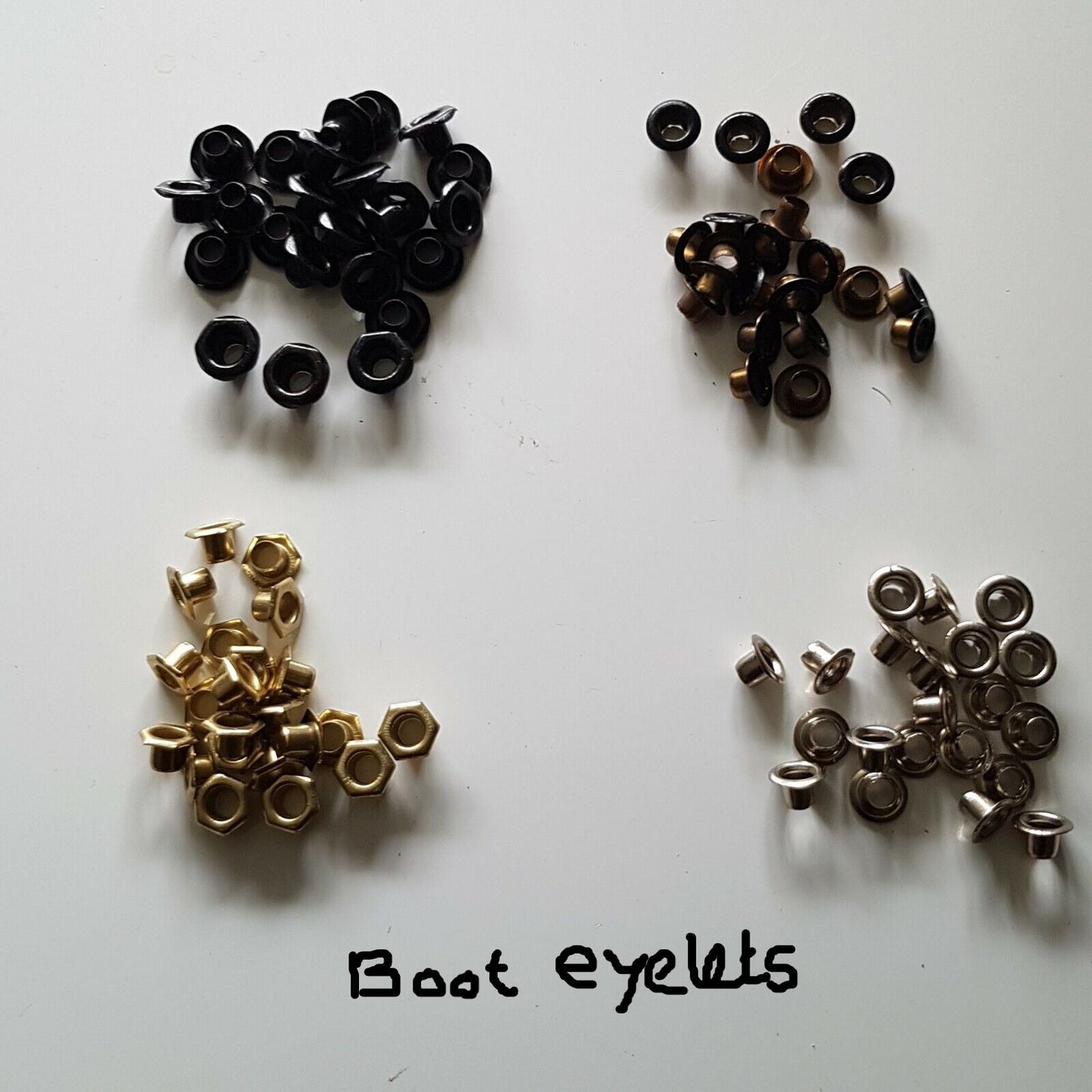Assorted sizes of boot eyelets and brass eyelets for shoes, displayed on a white background with a note indicating 'Boot Eyelets'.