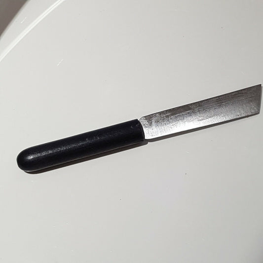 Full view of broad point heel parring knife of white background