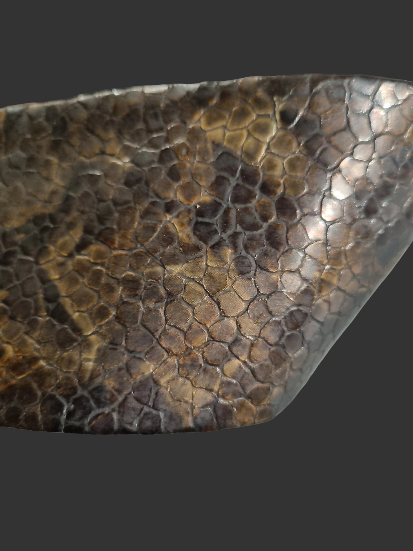 Close-up of a cobra snakeskin embossed women waist leather cinch belt showing copper brown scales detail and glossy finish.