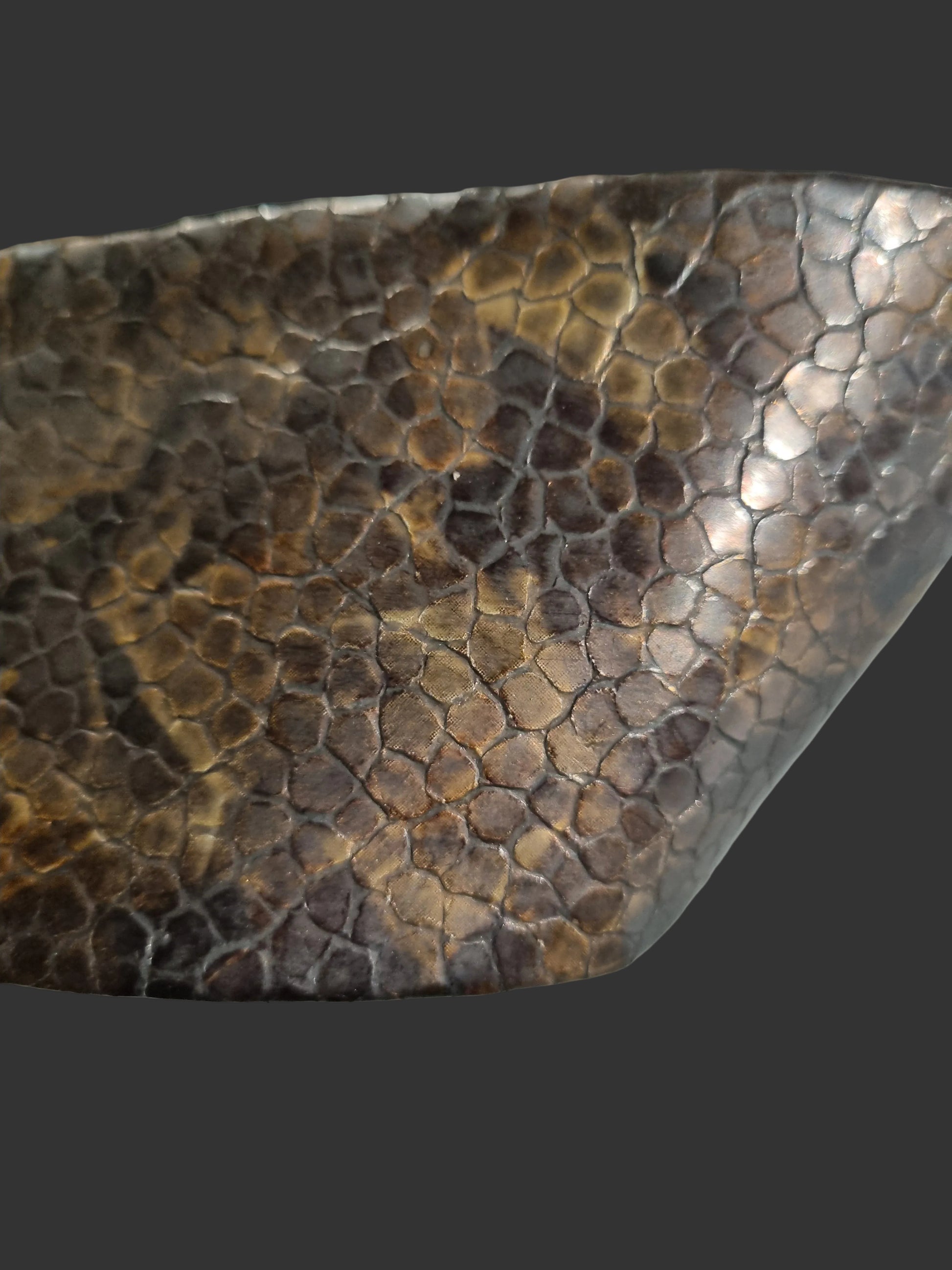 Close-up of a cobra snakeskin embossed women waist leather cinch belt showing copper brown scales detail and glossy finish.