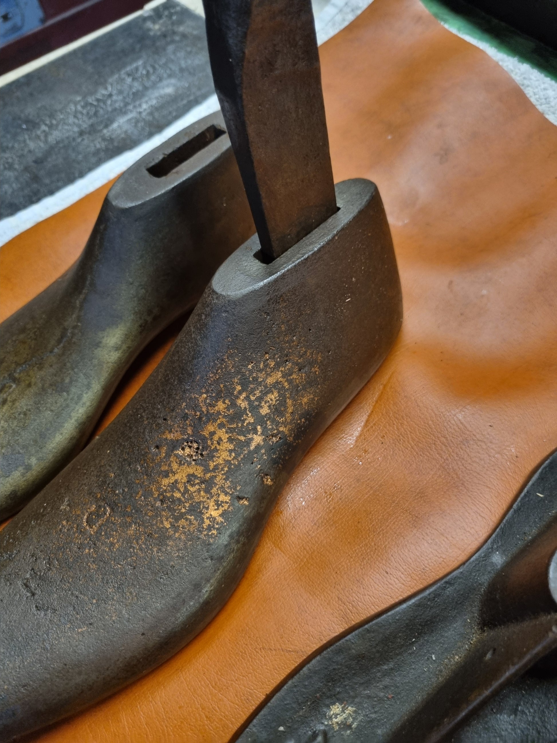 Cast iron shoe lasts with rod inserted
