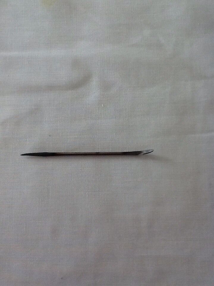 A single curved hooked awl blade made of cast steel, placed on a light background.