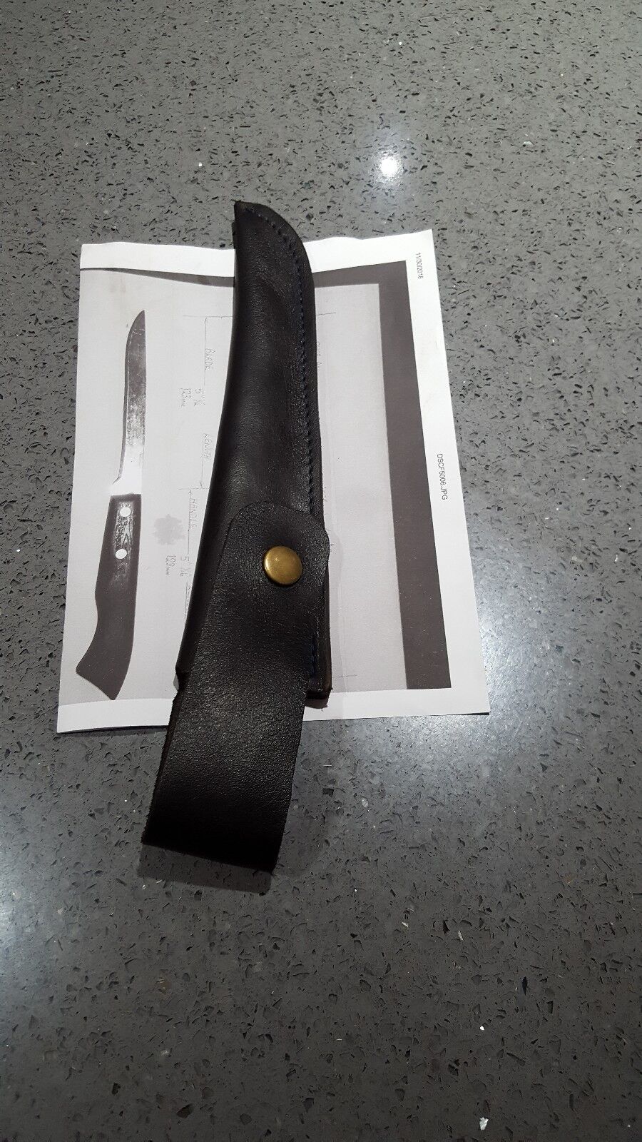 Black leather filleting knife with snap loop showing image of knife
