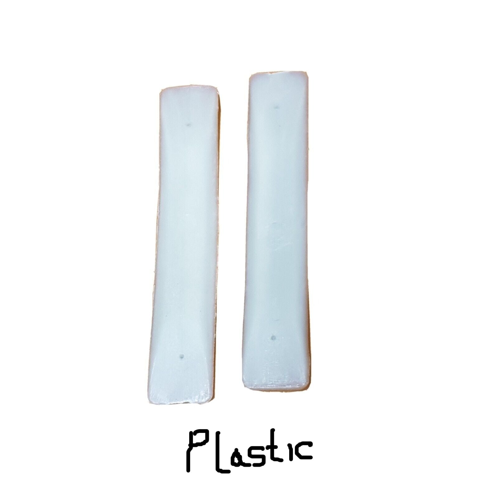 A pair of plastic shanks for boots or shoes laid on a white surface.