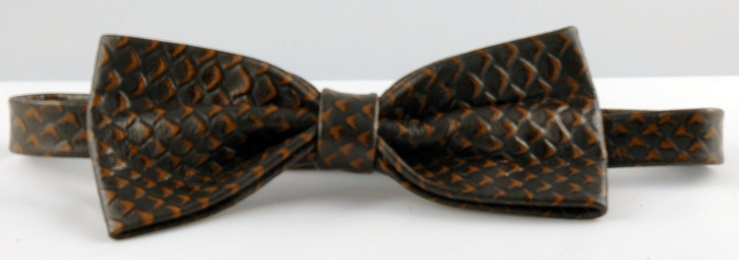 A brown leather bow tie with an exotic rattlesnake printed pattern.
