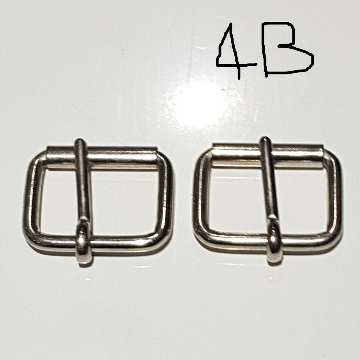 Two metal buckles with a chrome finish on a white background, labelled 4B 