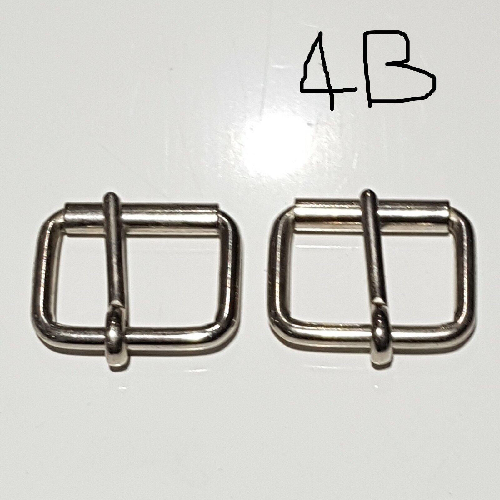 Two metal buckles with a chrome finish on a white background, labelled 4B 