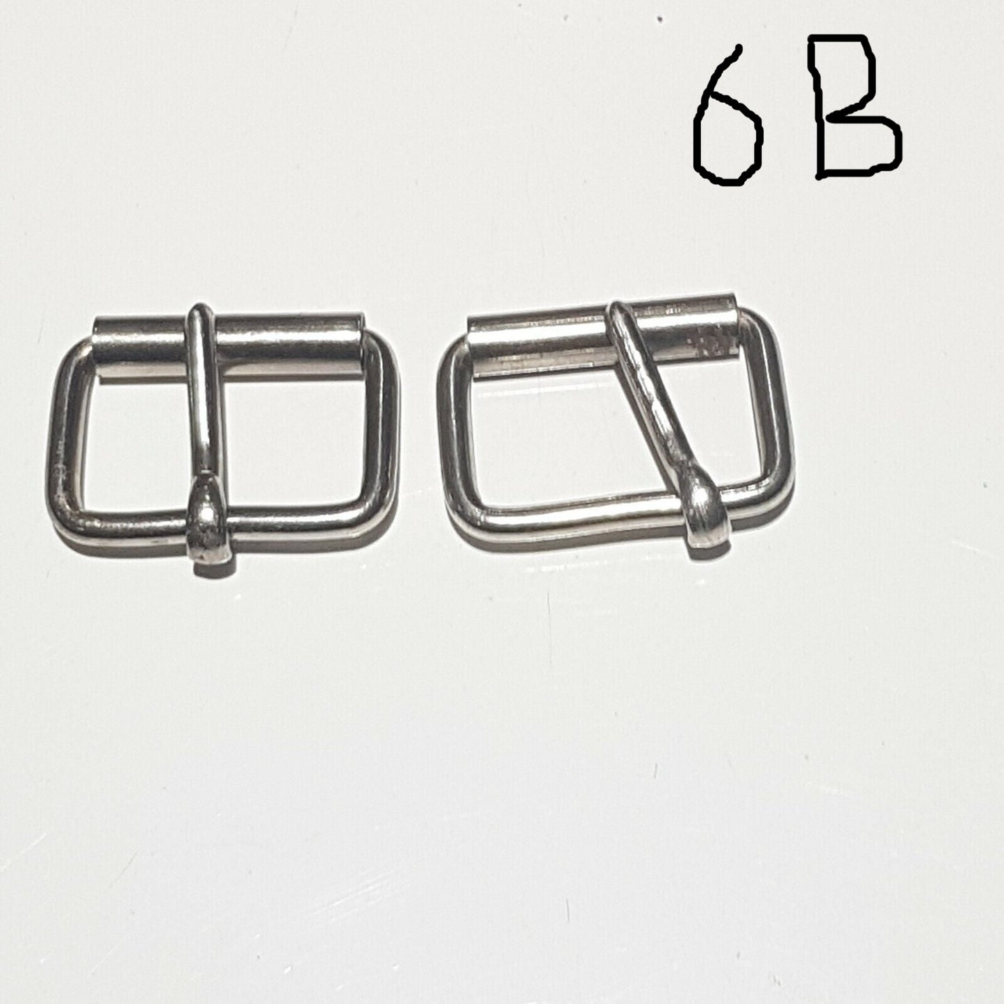 Two metal buckles with a chrome finish on a white background, labelled 6B 