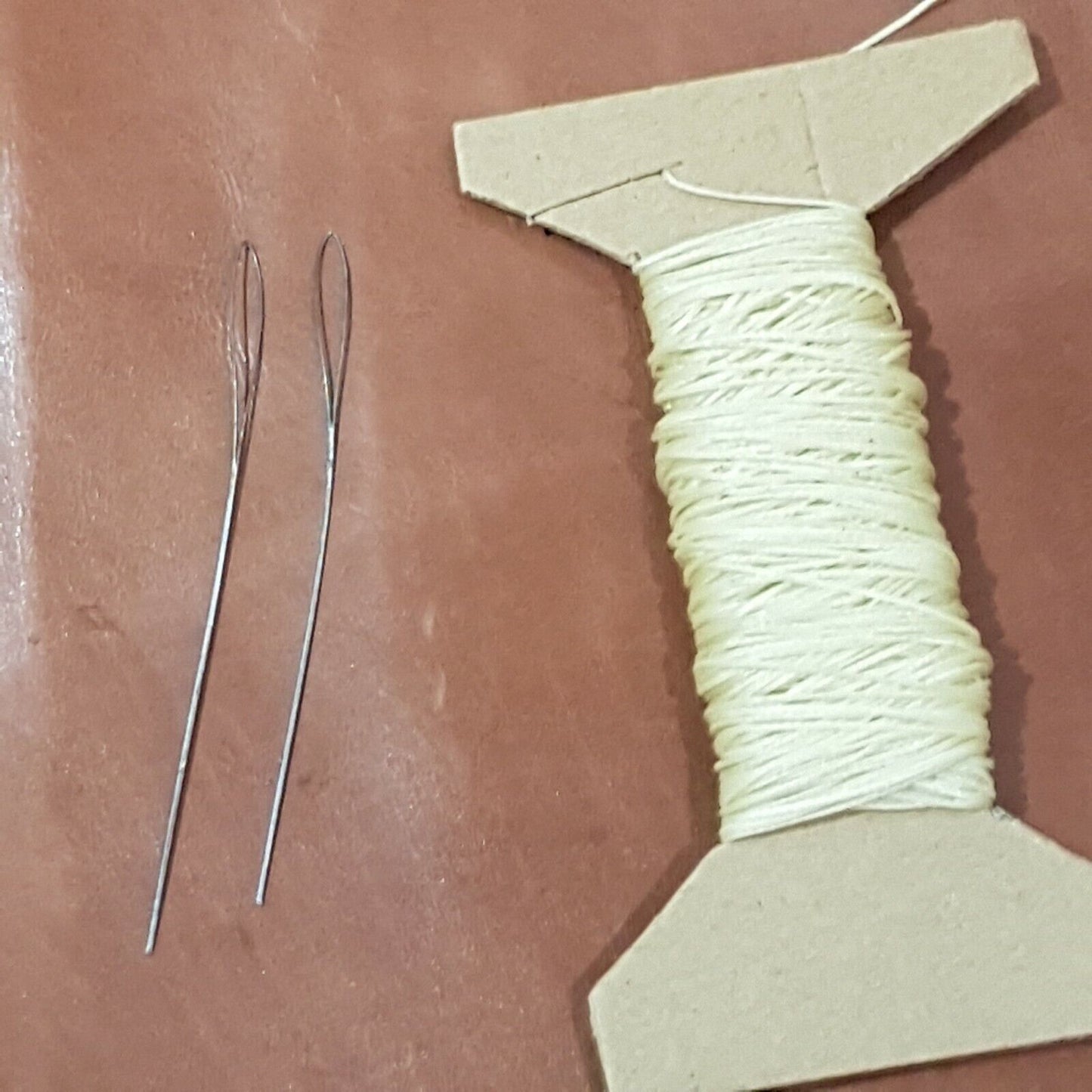 Hand sewing kit with wire needles and waxed threads