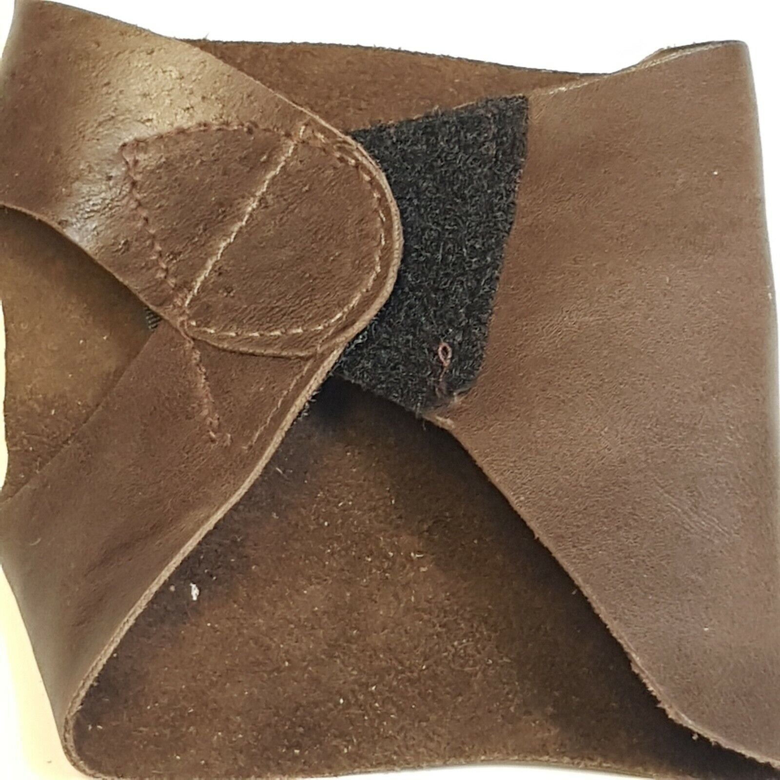 Close of folded leather palm showing hook and loop closurer