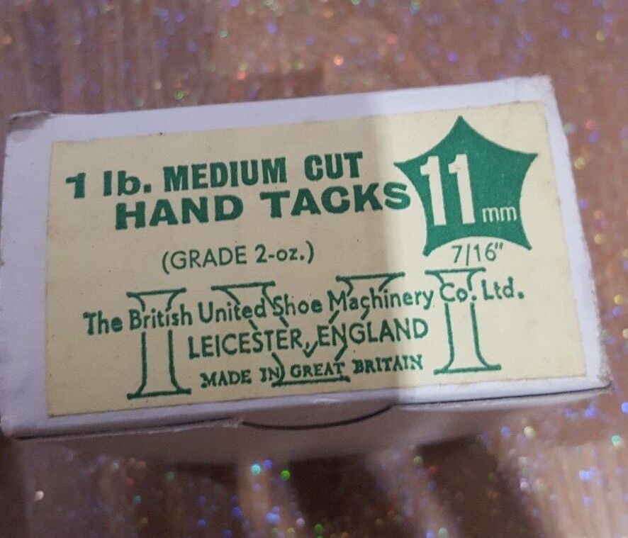 A box labelled 1 il MEDIUM CUT HAND TACKS 11mm (GRADE 2-oz) The British Shoe Machinery Co. Ltd. LEICESTER, ENGLAND made in great Britain. 