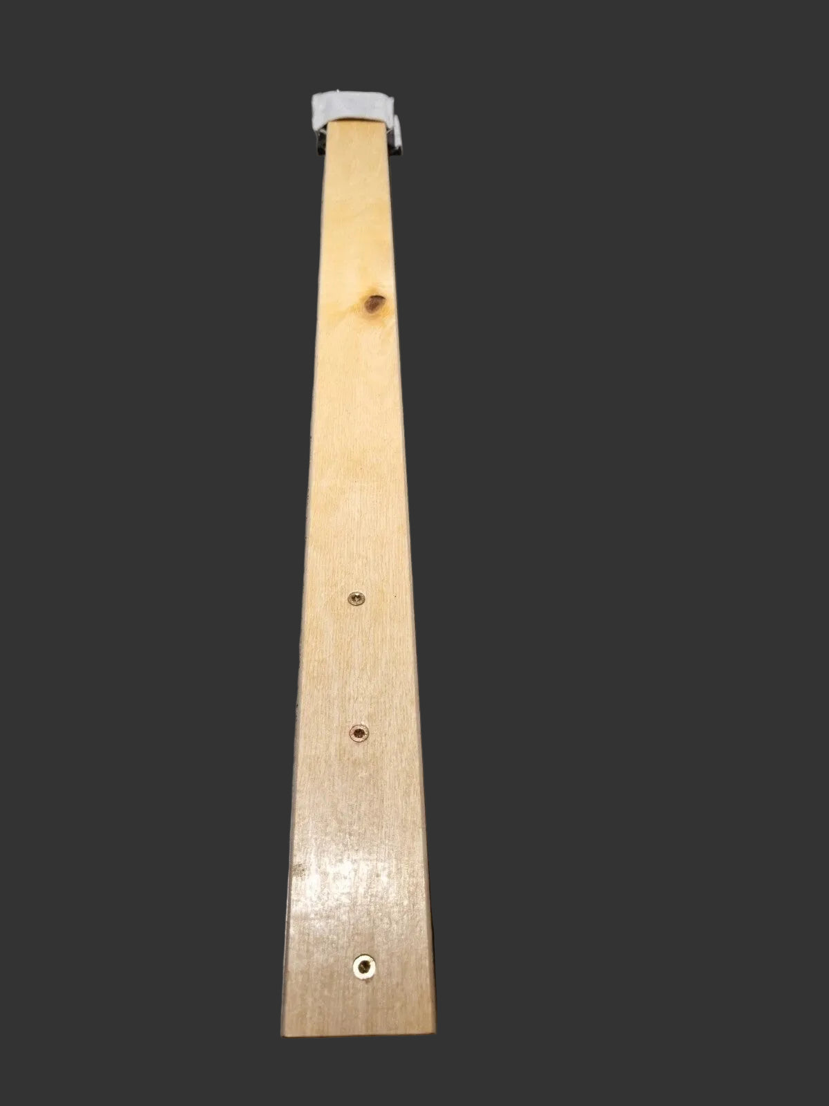 A long hand stitching clam made from birch wood showing  two narrow slats with pre-drilled screw holes and a small leather socks at the top 