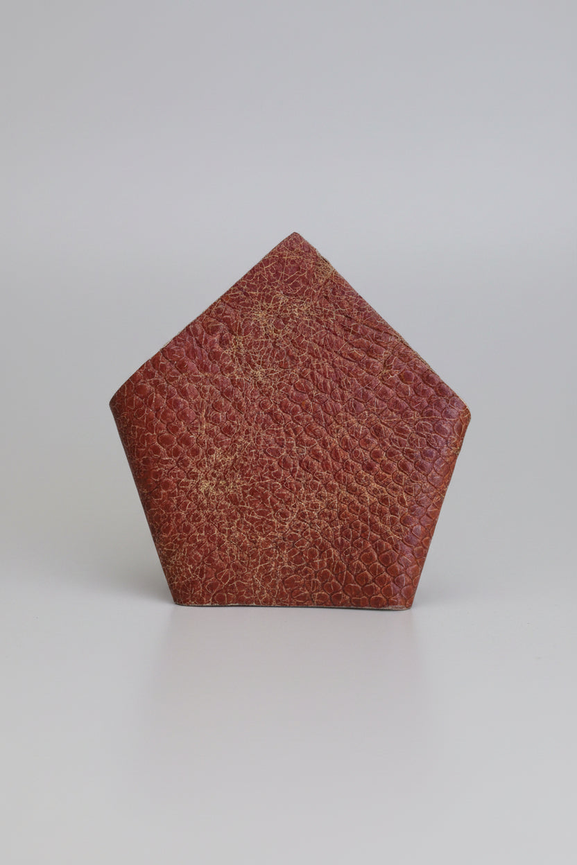 Leather suit square pocket tan colour  with a cobra pattern, displayed on a solid blue background.